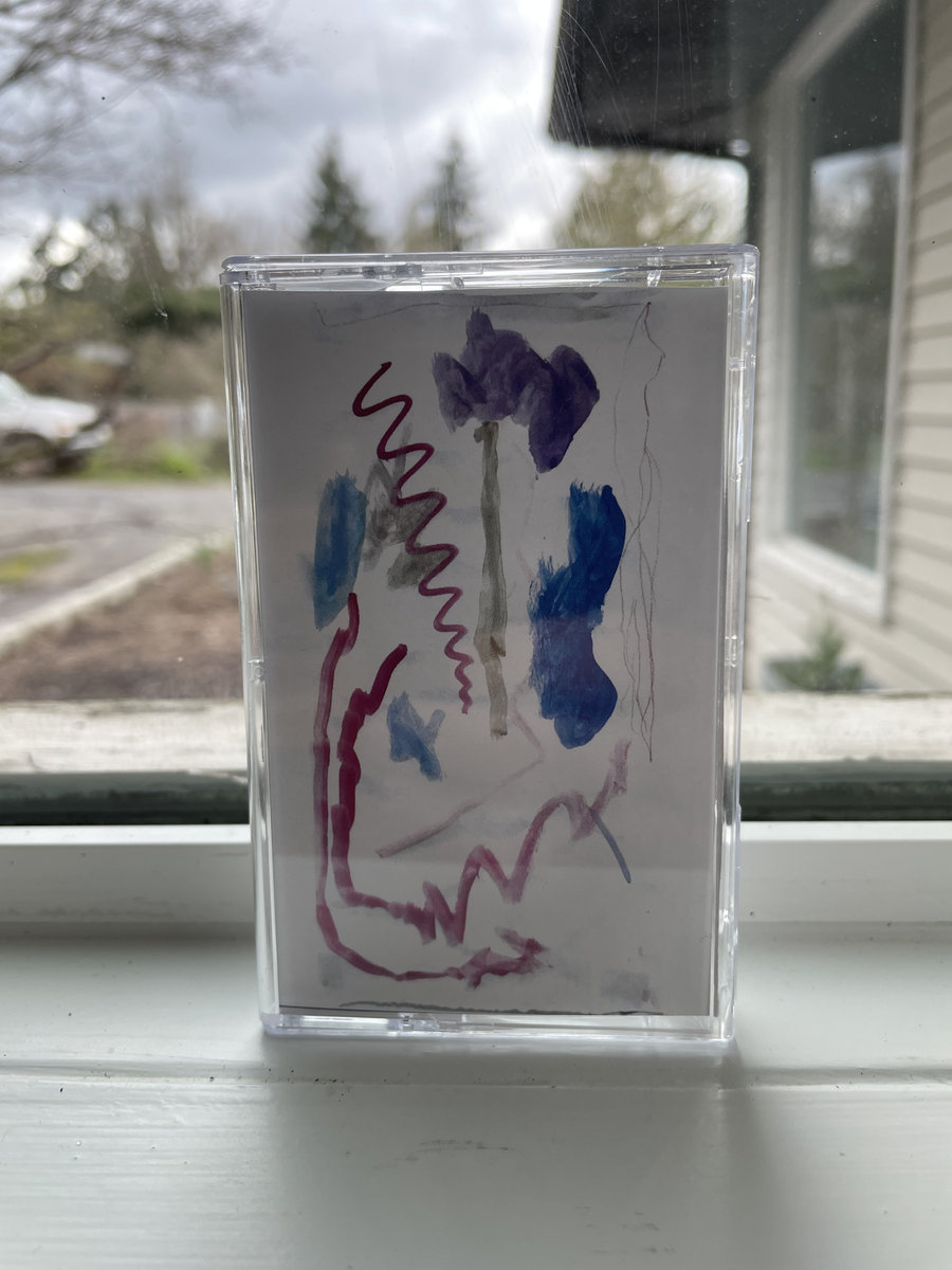 Image of Sean Pierce's album, Sackerl, on cassette tape in window sill on a cloudy day